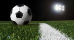 Soccer Ball On Field With Light  Stock Photo