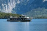 Tourists Enjoying An Excursion On Lake Hallstatt Stock Photo