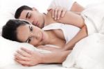 Loving Embracing Lying Couple Of Woman And Sleeping Man Stock Photo