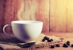 Vintage Coffee Cup And Bean On Table Stock Photo