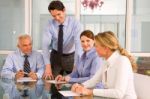 Business Men And Women In Meeting Stock Photo