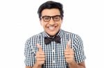 Young Man Showing Double Thumbs Up Stock Photo