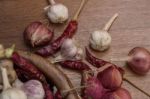 Garlic And Chillies On Wooden Stock Photo