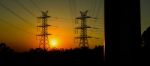 High Voltage Power Tower At Sunset Stock Photo