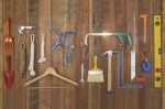 Hand Tools And Equipments Hang On Vertical Stripe Wood Board Stock Photo