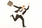 Businessman Running With Briefcase Stock Photo