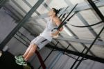 Young Gymnast Training On Rings Stock Photo