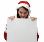 Santa Girl Looking At Sign Stock Photo