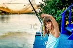 Little Girl Fishing On The River Bojana In Montenegro Stock Photo
