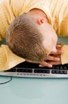 Tired Man Sleeping On Keyboard Stock Photo