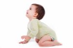 Side Pose Of Baby Sitting And Looking Up Stock Photo