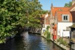 View Down A Canal In Bruges West Flanders In Belgium Stock Photo