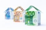 Three Houses Made Of Bank Notes Stock Photo