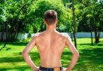 Young Male Athlete Demonstrates His Back Muscles Stock Photo