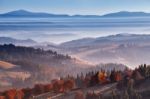 Morning Mist In Mountains. Sunrise And Autumn Mist Over The Hill Stock Photo