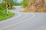 The Road Curves Up The Mountain Stock Photo