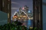 Sydney Opera House Illumnitated By Lights At Night Stock Photo