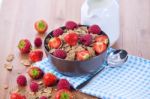 Bran Flakes With Fresh Raspberries And Strawberries And Pitcher Stock Photo