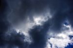 Dark Storm Cloud With Sun On The Sky Stock Photo