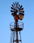 Old Windmill Making Electric Power Stock Photo