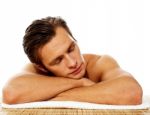 Man Relaxing In A Spa Resort On Mat Stock Photo