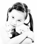 Young Cute Girl Hugging Her Teddy Bear Stock Photo
