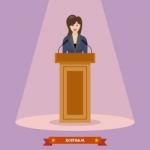 Politician Woman Standing Behind Rostrum And Giving A Speech Stock Photo