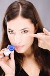 Woman Holding Contact Lens Stock Photo