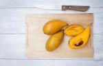 Canistel Fruit On Wooden Cutting Board Stock Photo