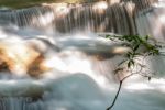 The Water Flowing Over Rocks And Trees Down A Waterfall At Huay Mae Khamin Waterfall National Park ,kanchana Buri In Thailand Stock Photo