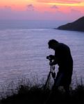 Taking Photograph Of Sunset    Stock Photo