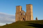 Remains Of Reculver Church Towers Bathed In Late Afternoon Sun I Stock Photo