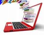 Stack Books Flying On Laptop Stock Photo