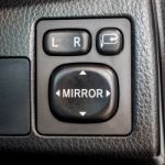 Switch Button Adjust Or Controls Side Mirrors In A Car Stock Photo