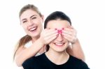 Girl In Playful Mood Teasing Her Friend Stock Photo