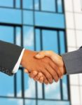 Businessmen Greet Each Other By Shaking Hands Stock Photo