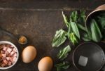 Ingredients For Florentine Eggs With Spinach On The Rusty Background Top View Stock Photo