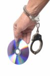 Dvd In Hand  With Handcuffs Stock Photo