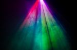 Beautiful Rainbow Color Wide Lens Projector With Light Beam For Movie And Cinema At Night . Smoke Texture Spotlight . Screening For Multimedia . Black Background  Stock Photo