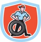 Tireman Mechanic With Tire Cartoon Shield Stock Photo