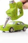 Hand Holding Eco Fuel Nozzle Stock Photo
