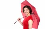Attractive Young Woman Holding An Umbrella Stock Photo