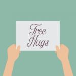 Hands Holding A Free Hugs Sign Stock Photo