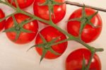 Fresh Cherry Tomatoes On A Cluster Stock Photo