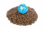 Globe With World On Heap Of Whole Coffee Beans Stock Photo