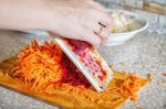 Woman Cooks The Beets On A Grater Stock Photo