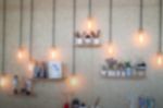 Blurred Vintage Hanging Light Bulb On The Wall Stock Photo