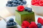 Green Tea Matcha Mousse Cake With Berries Stock Photo