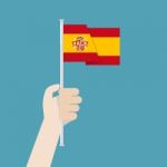 Hand Holding Up Spain Flag Stock Photo