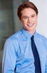 Young Smiling Relaxed Corporate Guy Stock Photo